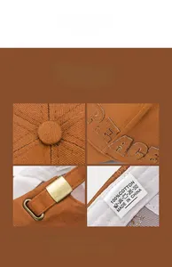 Détails d'une casquette en coton marron avec broderie PEACE et boucle en métal