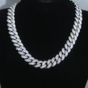 Silver cuban chain necklace with full diamonds on a black velvet mannequin display