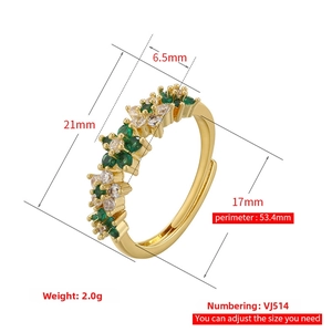 Detail of adjustable gold-plated ring with green and white cubic zirconia floral inlay