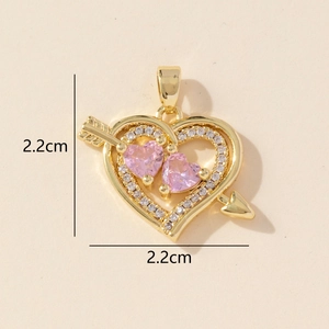 Detail of 2.2cm gold heart pendant with pink stones and sparkling cubic zirconia