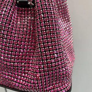 Elegant rose red rhinestone bucket bag with sparkling crystals for evening wear