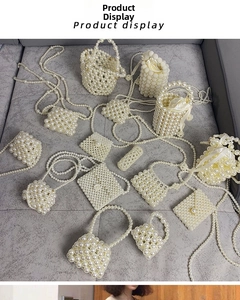 Detail display of multiple handmade pearl woven bags with silk drawstring inner pouches