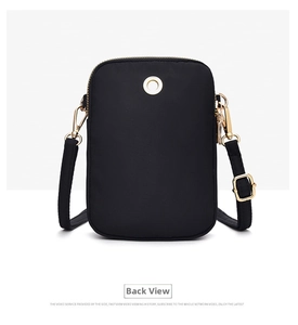 Rear view detail of black nylon phone bag showing the headphone jack and gold hardware
