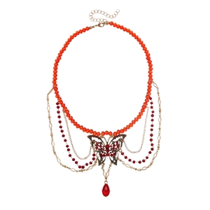 Vintage orange beaded necklace with butterfly pendant and elegant rhinestone tassels