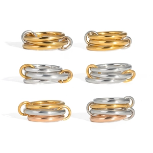 Detailed view of interconnected triple rings in gold silver and rose gold stainless steel