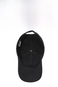 Detail view of black baseball cap interior with breathable eyelets and adjustable strap