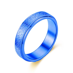 Macro shot of rotatable blue frosted titanium steel ring with polished beveled edges