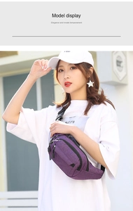 Detail view of deep purple oxford waist bag with multi-zipper layers and durable strap