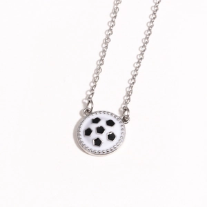 Detailed close-up of a silver-bordered soccer ball pendant necklace with sports design