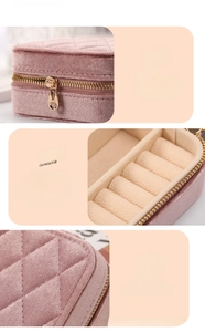 Detailed view of pink quilted jewelry box featuring premium metal zipper and velvet lining