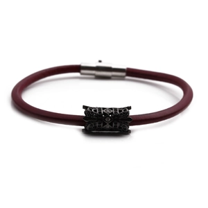 Burgundy braided leather bracelet for men featuring black hollow metal charms and silver clasp