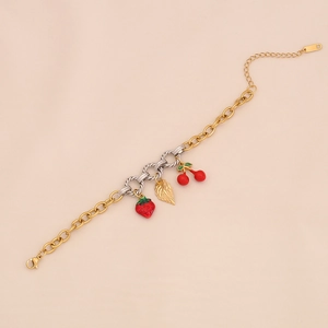 Detail of strawberry and cherry charms on a dual-tone stainless steel chain bracelet