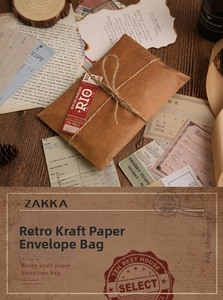 Detail of vintage kraft paper envelope with jute rope twine and retro luggage stickers