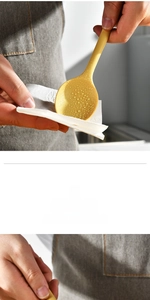 Macro shot of flexible yellow silicone spoon showing soft texture and water resistance