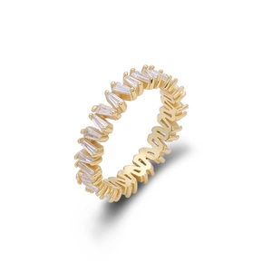 Macro shot of gold eternity ring with rectangular zircons on a white background