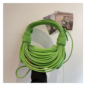 Detailed view of the knotted rope texture and vibrant green finish of the shoulder bag