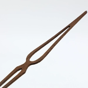 Elegant walnut wood clock hands with natural grain in a minimalist streamlined design