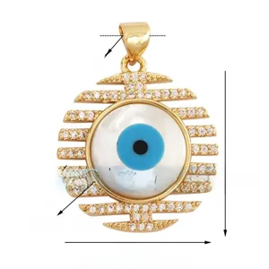 Macro detail of evil eye fishbone pendant with shell inlay and cubic zirconia stones