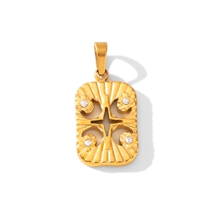 Macro shot of 18K gold plated rectangular pendant with star motif and zircons