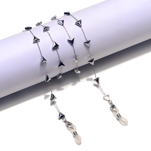 Silver stainless steel eyeglass chain featuring geometric triangle pendants and silicone loops