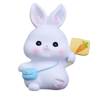 Cute white cartoon rabbit figurine with blue bag and carrot flag for car dashboard