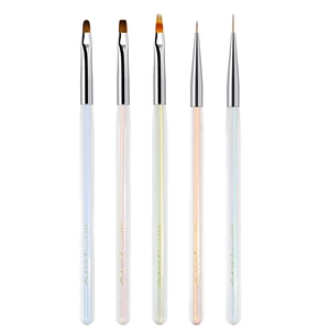 Five-piece professional nail art brush set with pearl white handles and gold metal accents