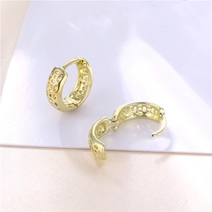 Golden hollow honeycomb geometric hoop earrings for women in a minimalist bohemian style