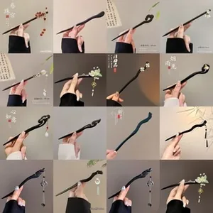 Detail view of 18cm vintage wooden hair sticks with elegant tassels and floral accents