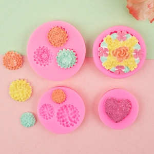 Set of four pink silicone molds with flower and heart patterns for DIY clay cake decor