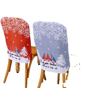 Christmas gnome forest chair covers in red and grey knit fabric for holiday dining decor