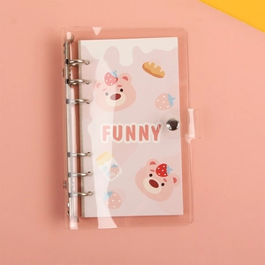 Detail of transparent PVC A6 binder notebook featuring pink cartoon bear and metal ring binder