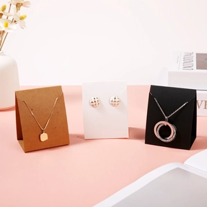 Vertical jewelry display cards for necklaces and earrings in kraft, white and black colors