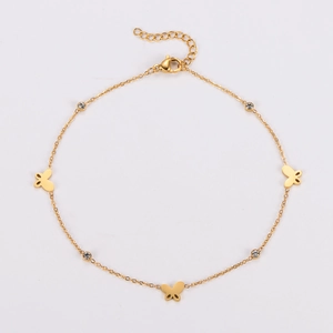 Detail of gold butterfly anklet with sparkling rhinestones and lobster clasp closure