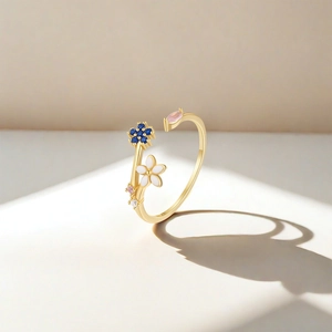 Macro detail of S925 silver ring featuring blue star zircon and white enamel flower petals