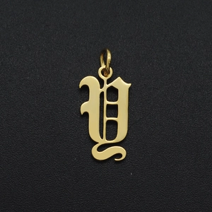 Detailed view of a gold Gothic letter Y pendant accessory made of stainless steel