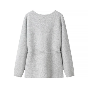 Minimalist light grey long sleeve knit sweater with decorative waist stitching
