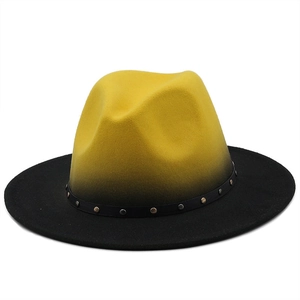 Detail of yellow and black gradient fedora hat with studded leather band and wool texture