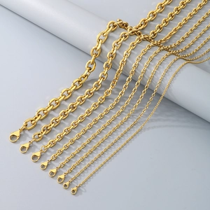 Detail of various gold stainless steel cable chain necklaces with lobster clasps in different sizes