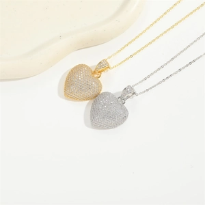 Minimalist gold and silver heart necklaces with sparkling pavé cubic zirconia pendants