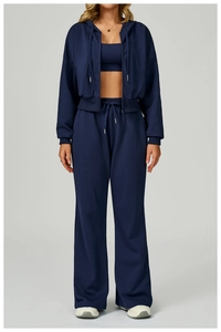 Detailed view of women's navy blue 3-piece waffle knit tracksuit with zip hoodie and pants