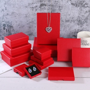 Detailed view of red textured jewelry gift box set in various sizes and shapes