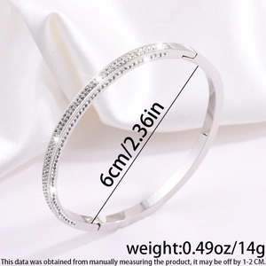 Detailed view of silver titanium steel bracelet showing 6cm diameter and 14g weight info