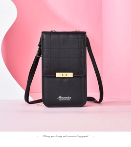 Detail of black quilted crossbody phone bag with a gold rectangular metal lock