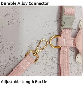 Detail of pink corduroy pet harness with durable alloy hook and adjustable buckle
