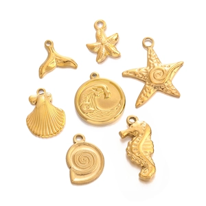 Golden stainless steel ocean pendants featuring starfish seahorse and shell designs