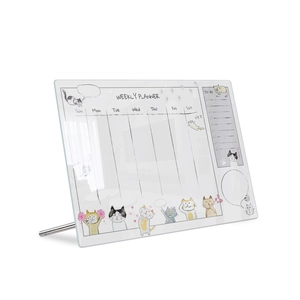 Detailed macro view of acrylic weekly planner with cat illustrations and metal stand