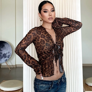 Detail of leopard print sheer mesh cardigan featuring front tie design and cropped fit