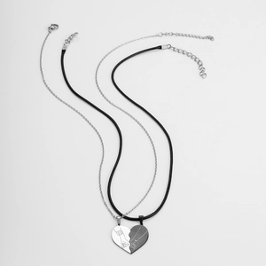 Matching stainless steel heart pendant necklace set for couples with engraved hand gesture