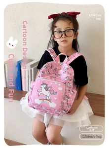 Pink school backpack with unicorn and rainbow prints featuring adjustable padded straps