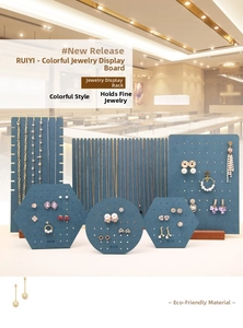 Detailed view of green jewelry display boards with wooden bases for necklaces and earrings